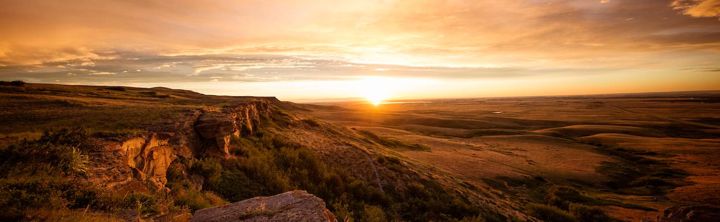 Sunset over a prairie valley.