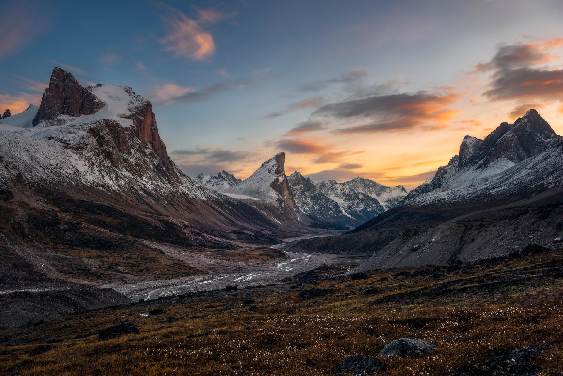 Snow-covered mountains and sunset skies