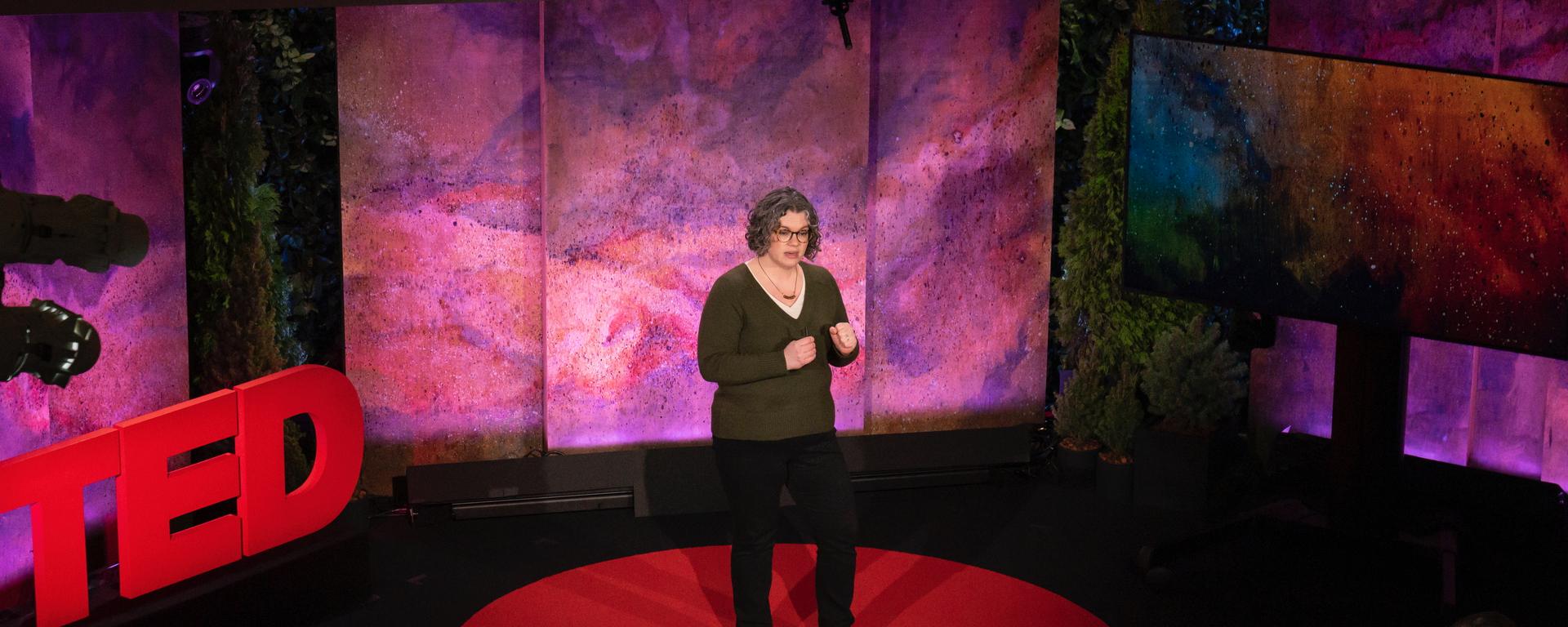 Alona Fyshe gives a TED talk on the TED stage.