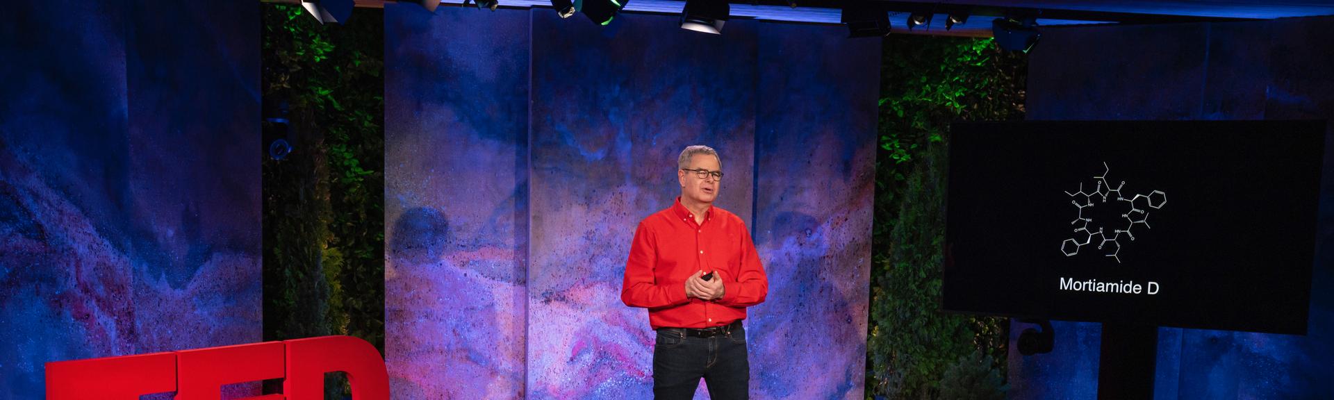 Normand Voyer gives a TED talk on the TED stage.