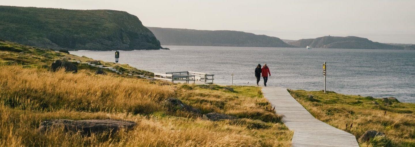 Landscape photo with a path leading to a view of the sea