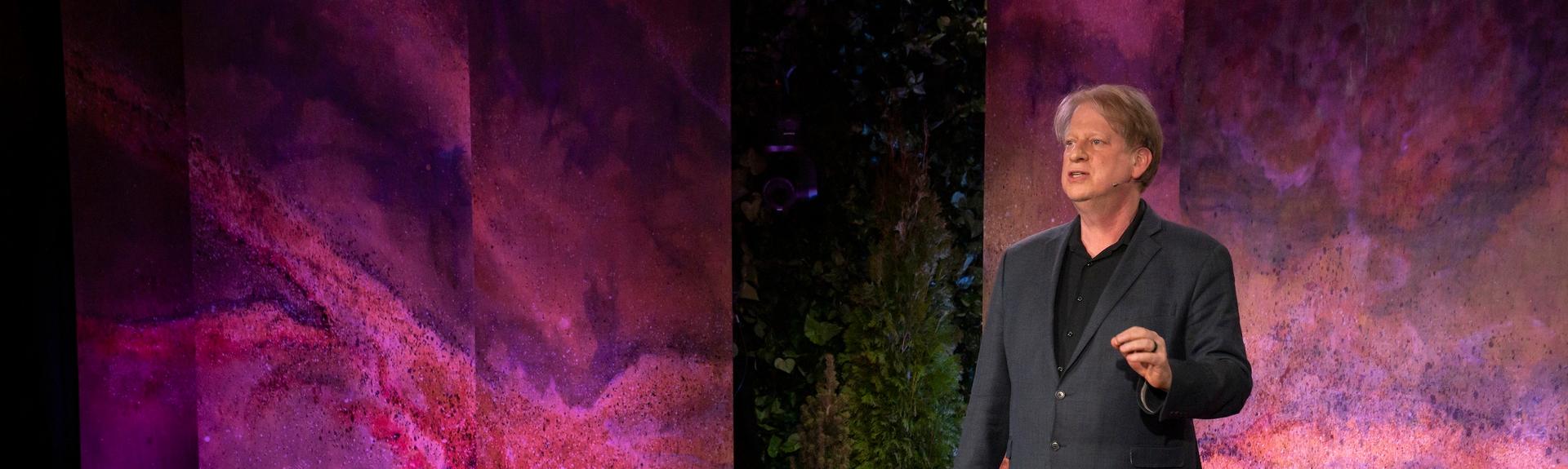 Paul Bloom presenting at TED on a stage